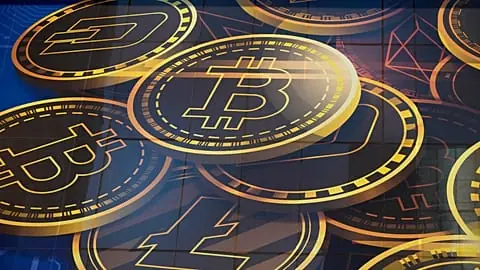 FILE. An advertisement for Bitcoin displayed on a building in Hong Kong, Nov. 2021