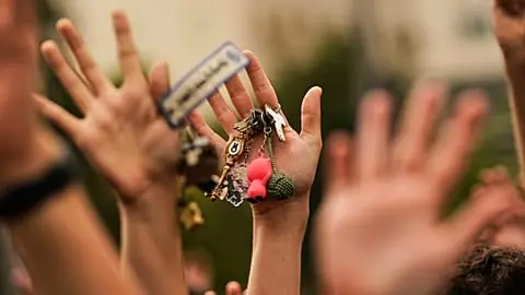 FILE. People hold up keys as a sign of protest during a demonstration demanding stronger laws to protect renters in Madrid, Spain, 3 Oct. 2026