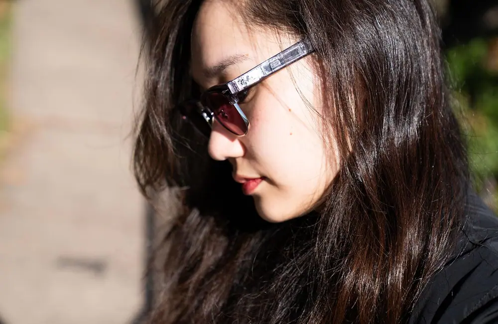 Side profile view of senior reviewer Victoria Song wearing the Ray-Ban Meta Audio glasses.