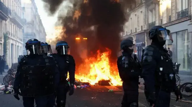 Riot police near a fire in central Paris