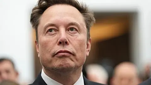 FILE - Elon Musk listens as President Donald Trump speaks during an event at the U.S. Institute of Peace, 8 Oct. 2026, in Washington.