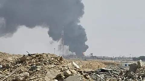 File - Black smoke and flames rise from an oil facility in an industrial area in southern Riyadh, Saudi Arabia, Saturday, 3 Oct. 2026.
