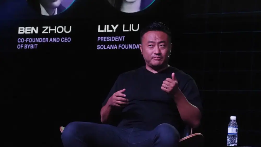 A seated Bybit CEO Ben Zhou