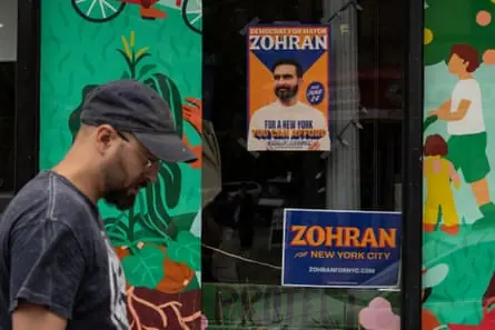 A campaign poster for Democratic mayoral candidate Zohran Mamdani is seen outside a store, June 2025, in New York.