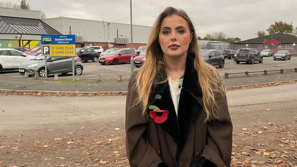 Rosey Greenwood standing next to a payment machine at the Copeland Street car park in Derby in November 2024