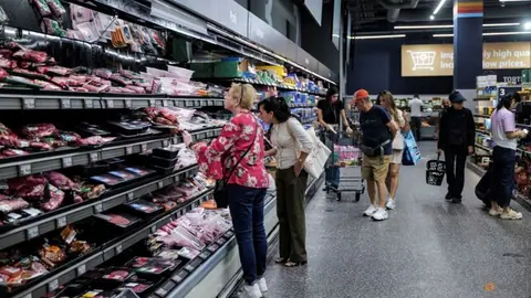 High inflation to persist globally into next year, Reuters poll shows