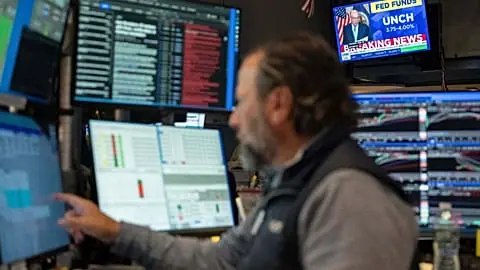 A television screen on the floor of the New York Stock Exchange displays the rate decision of the Federal Reserve, Wednesday, Oct. 28, 2026, in New York.