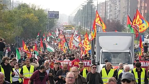 Workers, students and activists demonstrate during a nationwide general strike called by grassroots unions to protest rising living costs, low wages and military spending.